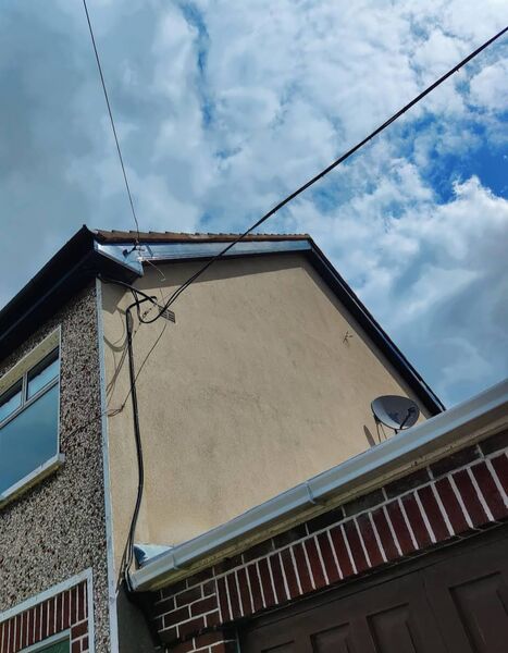 Professional ridge tile replacement completed by Johnson's Roofing in Didsbury, Manchester area - High quality cedar shingles installation